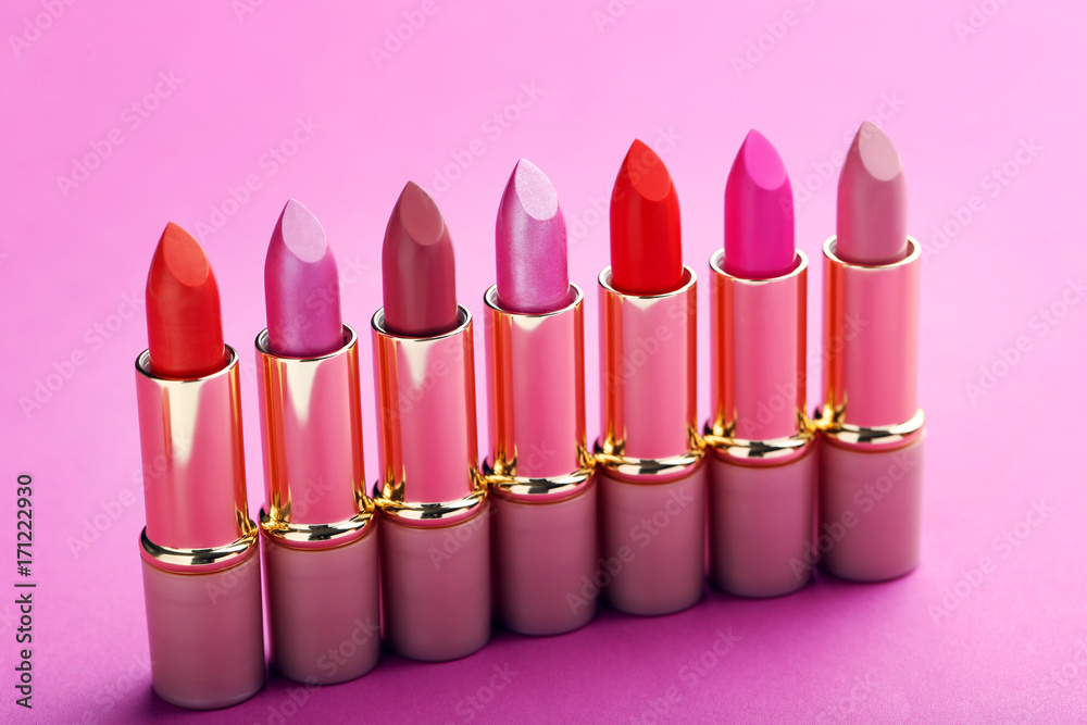 Colorful lipsticks on a pink background Colorful lipsticks on a pink background