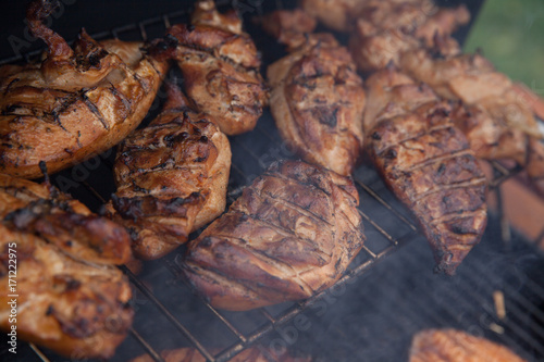 Grilled chicken breast on the grill photo