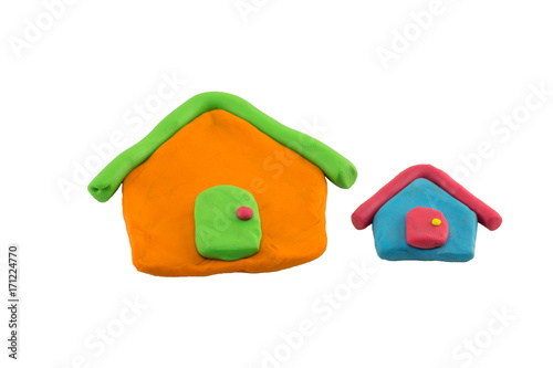close up play dough two houses isolated on white background.