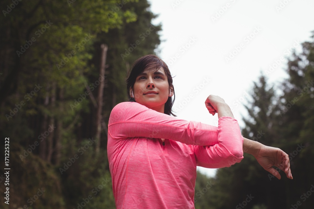Woman performing stretching exercise Woman performing stretching exercise