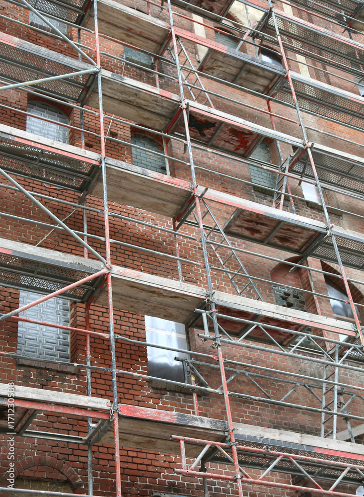 building during maintenance works with the metal scaffold building during maintenance works with the metal scaffold