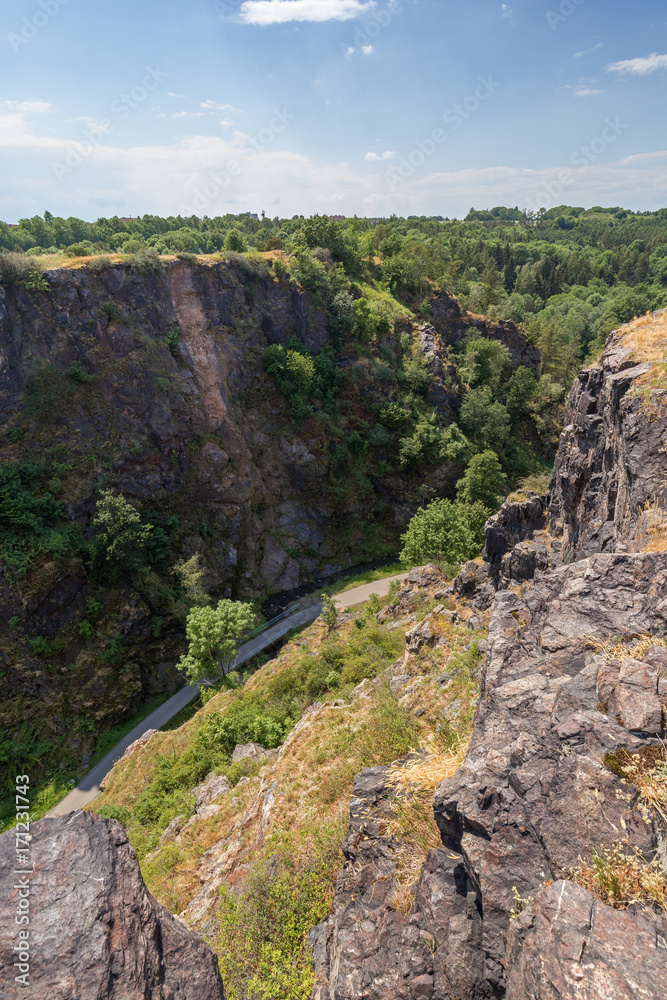 Steep and rugged gorge viewed from the top at the Divoka Sarka. It's a nature reserve on the outskirts of Prague in Czech Republic.