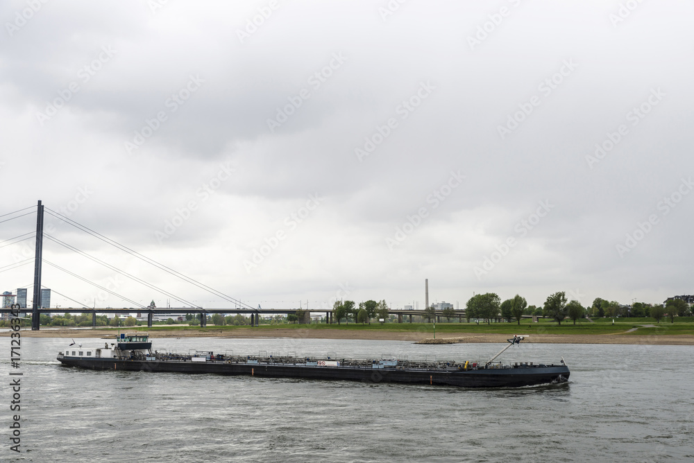 Cargo ship sailing on the Rhine River in Germany