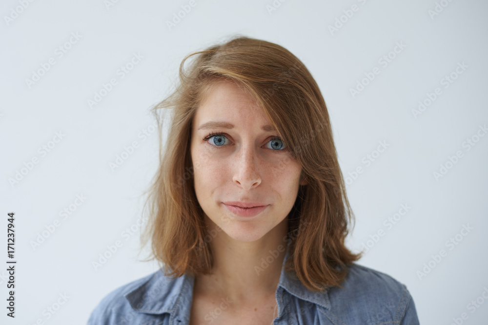 Portrait of sad unhappy European girl having problem, looking with worried expression on her face. Beautiful blue-eyed female staring at camera with sorrow or concern while experiencing hard times Portrait of sad unhappy European girl having problem, looking with worried expression on her face. Beautiful blue-eyed female staring at camera with sorrow or concern while experiencing hard times