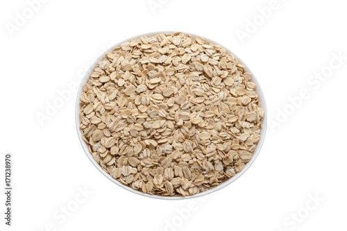 Oat flakes in a bowl isolated on a white background. Healthy Food. Diabetes eating. Oatmeal Day.