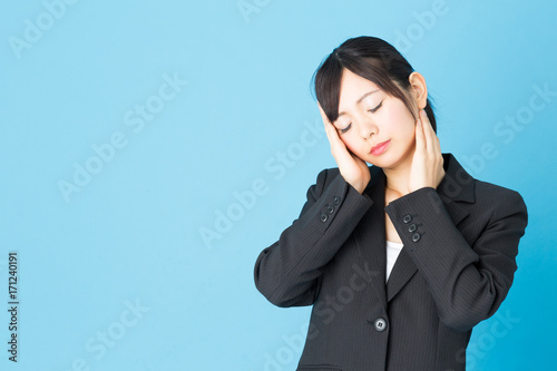 portrait of asian businesswoman isolated on blue background