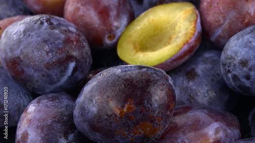 Rotating slate slab with some fresh Plums (4K footage; not loopable)