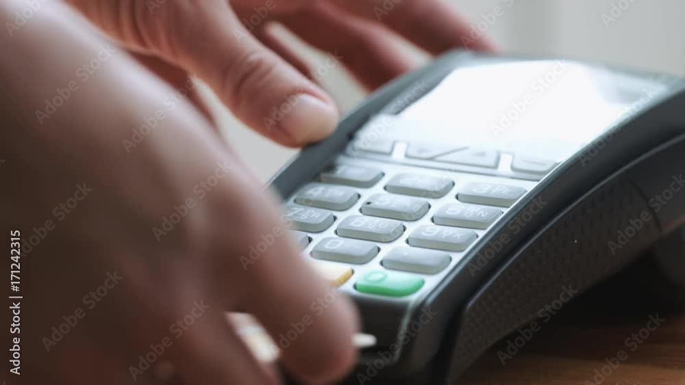 Close-up shot of person using credit card for mobile payment Close-up shot of person using credit card for mobile payment