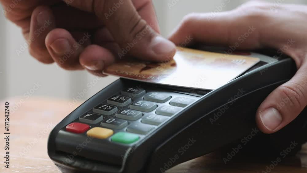 Close-up shot of person using mobile payment PayPass. Close-up shot of person using mobile payment PayPass.