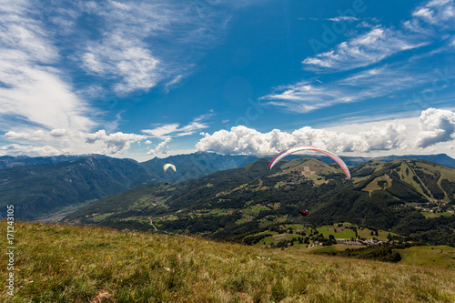 Paragliding in the sky over the dolomites