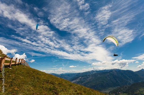 Paragliding in the sky over the dolomites