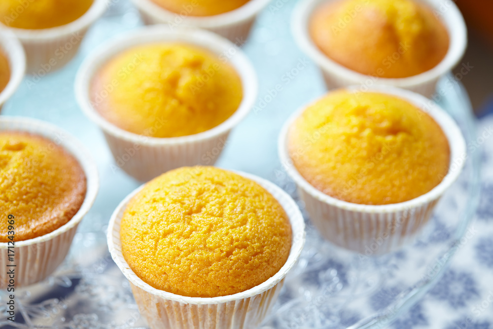 Closeup view of cake stand with Italian carrot muffins called Camilla, selective focus. Closeup view of cake stand with Italian carrot muffins called Camilla, selective focus.