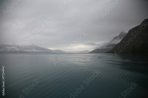 Still and serene grey winter morning on Lake Wakatipu, New Zealand