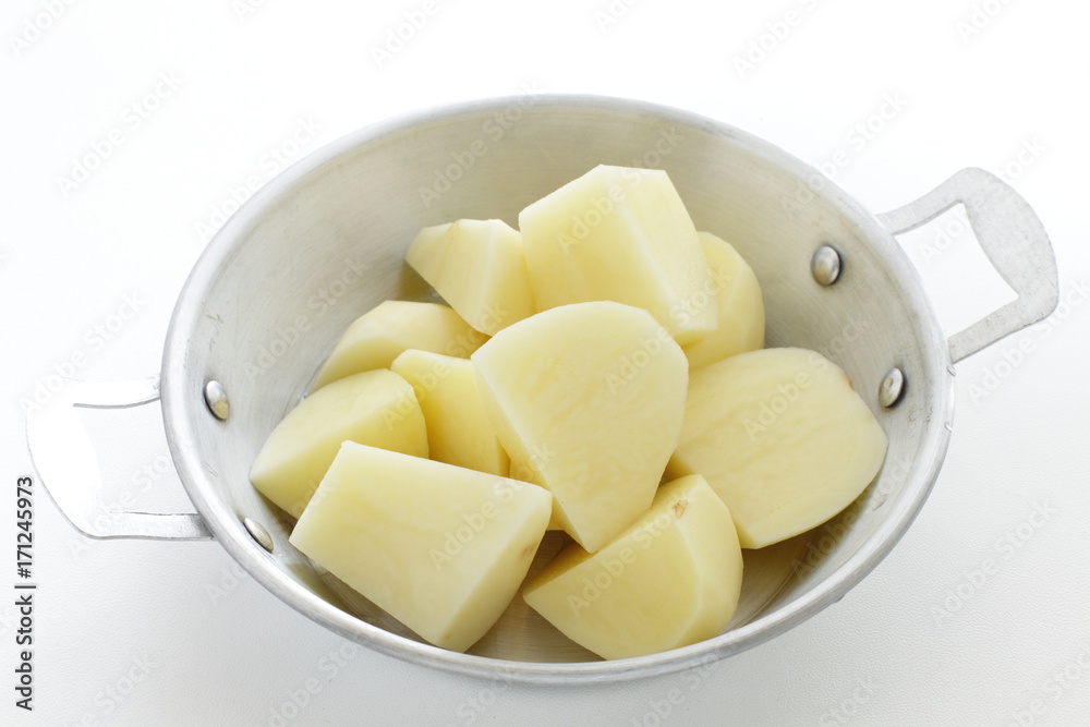 chopped potato on stainless steel pan chopped potato on stainless steel pan