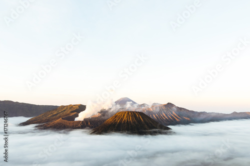 View of Mts. Bromo, Semeru, Batok and Widodaren and sea of clouds at the sunrise time in Bromo Tengger Semeru National Park, East Java, Indonesia photo