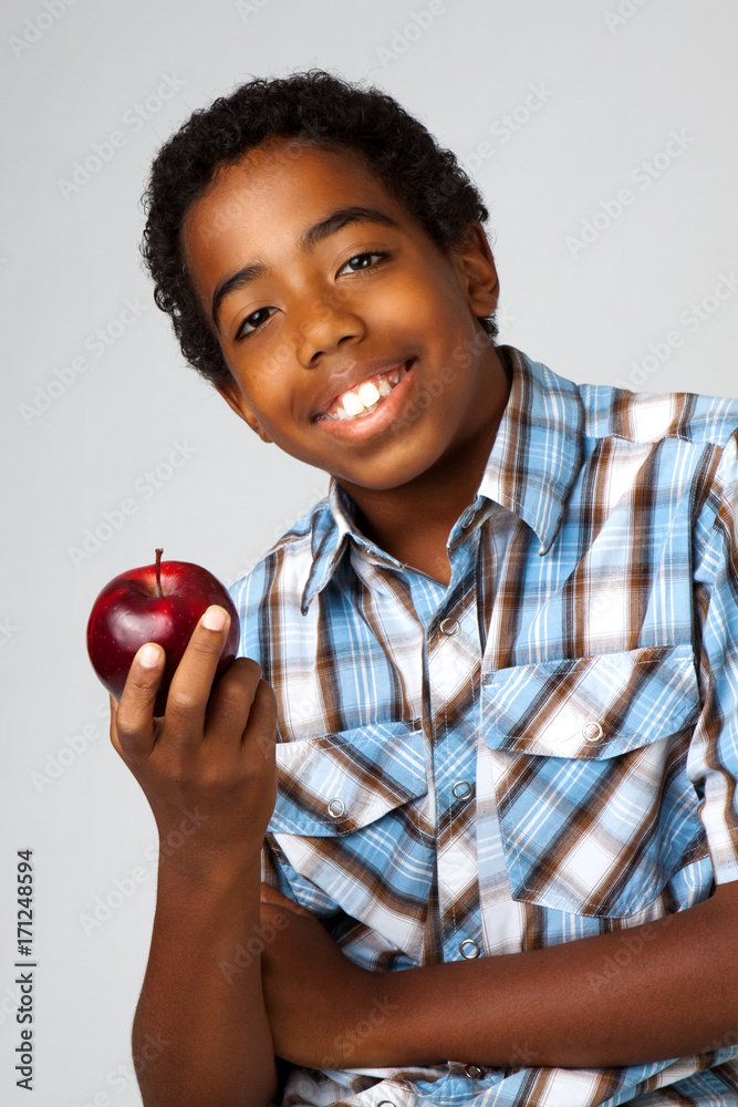 Young kid eating an apple. Young kid eating an apple.