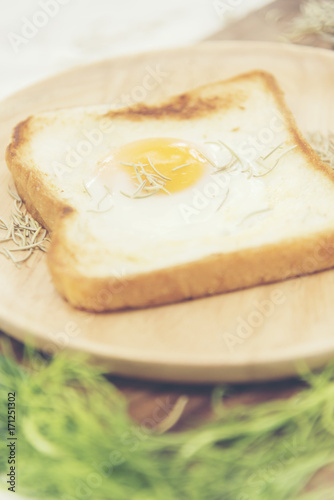 Breakfast consists of fried bread egg and vegetables.