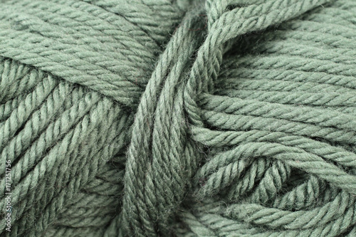 A super close up image of forest green yarn