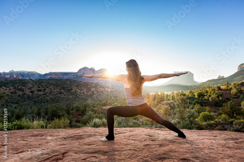 Woman Doing Yoga to Early Morning Sunrise