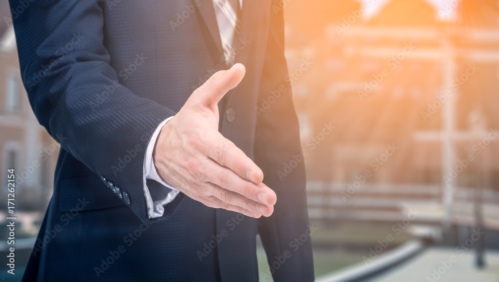 Business offer, partnership. Businessman holds out his hand