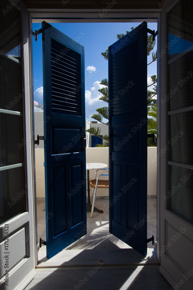Blue door and window with shutters Blue door and window with shutters