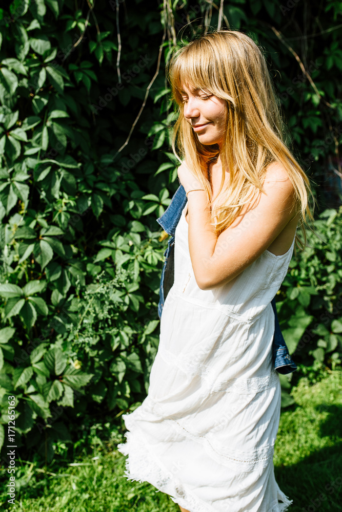 Blonde hair beautiful girl on the flower field Blonde hair beautiful girl on the flower field