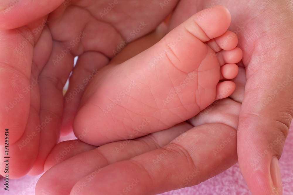 baby foot in hand mom. baby foot in hand mom.