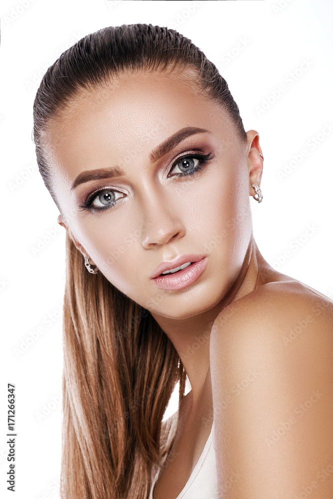 Fototapeta premium portrait of a beautiful tanned brunette woman with makeup 