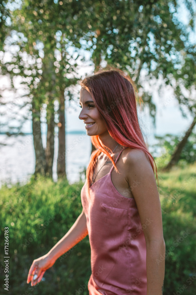 Portrait of stylish pink hair girl in the forest Portrait of stylish pink hair girl in the forest