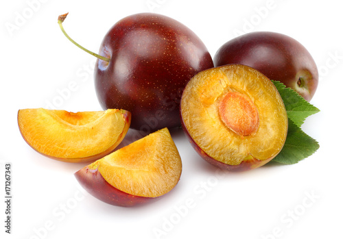 fresh plum fruit with cut plum slices isolated on white background