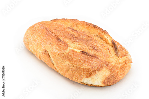 Closeup of a whole sourdough bread isolated on white background.