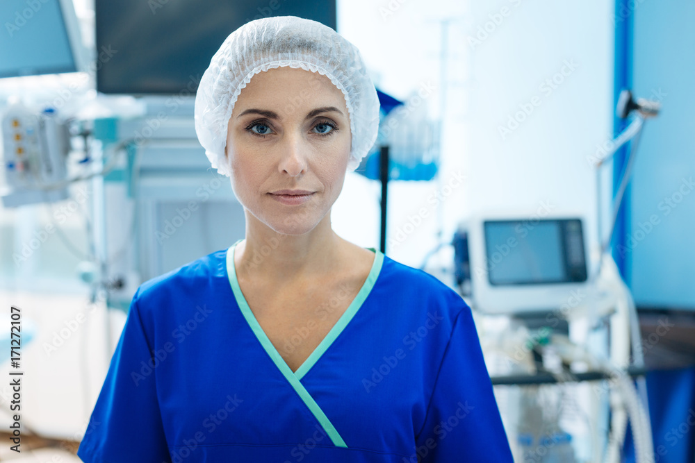 Fototapeta premium Serious nurse looking straight at camera