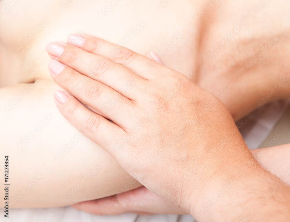 Woman receiving osteopathic treatment of her shoulder Woman receiving osteopathic treatment of her shoulder