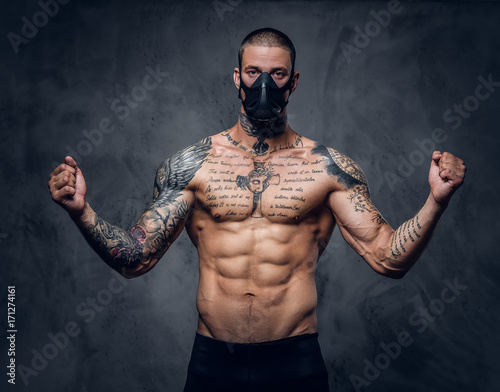 Fighter male over grey vignette background. © Fxquadro