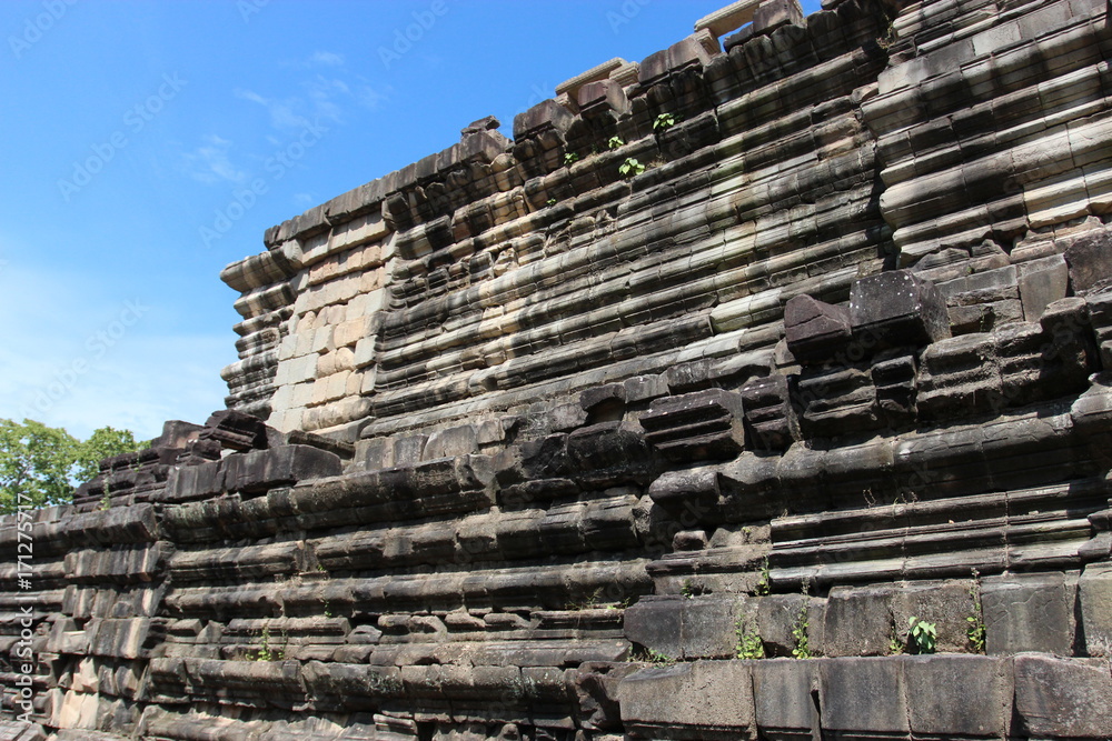 Ruins and walls of an ancient city in Angkor complex, near the ancient capital of Cambodia - Siem Reap Ruins and walls of an ancient city in Angkor complex, near the ancient capital of Cambodia - Siem Reap