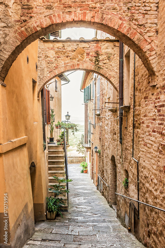 Fototapeta Naklejka Na Ścianę i Meble -  Beautiful narrow street in Montepulciano in Tuscany Italy. Montpulciano is famous for its wine.
