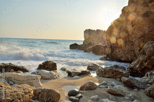 Enormous waves crashing on the shore and on the rocks at the Megali Patra Beach at the sunset, Lefkada Island, Greece
