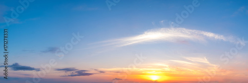 Vibrant color panoramic sun rise and sun set sky with cloud on a cloudy day. Beautiful cirrus cloud. Panorama high resolution photograph.