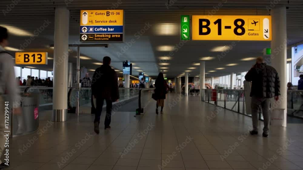 Busy male and female passengers hurrying to gate at airport terminal, trip