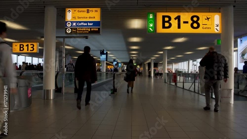 Busy male and female passengers hurrying to gate at airport terminal, trip