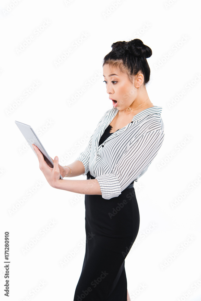 shocked businesswoman using tablet shocked businesswoman using tablet