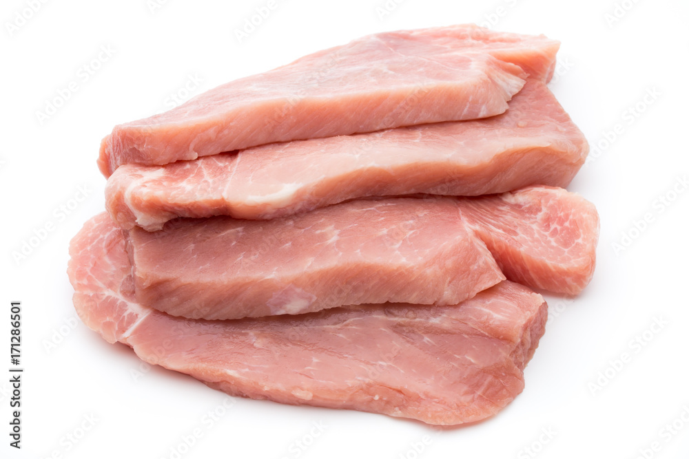 Fresh pork fillet with basil on a white background.