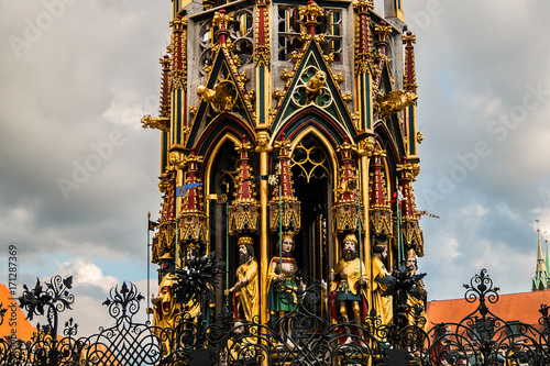 Detail of Beautiful fountain (Schoner Brunnen) and statue. 19 meters high Schoner Brunnen - 14th-century fountain located on Nuremberg's main market, built by Heinrich Beheim. Nuremberg, Germany. photo