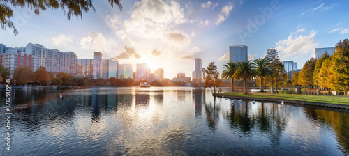 Sunset at Orlando in Lake Eola Park with water fountain and city skyline, Florida, USA photo