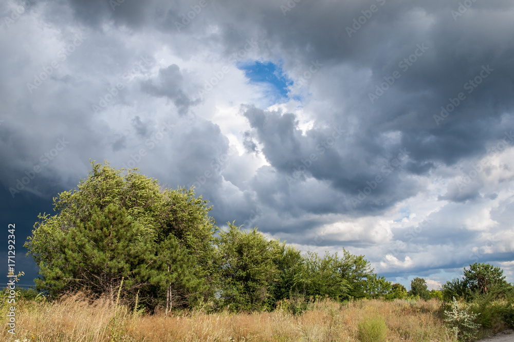 Summer landscape with dramatic cloudy sky Summer landscape with dramatic cloudy sky