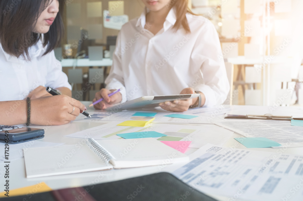 Two business woman discussing documents and ideas at meeting,business consulting concept. Two business woman discussing documents and ideas at meeting,business consulting concept.