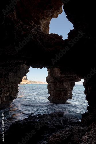 Cave of the arches in the cove of Moraig in Valencia. Spain.