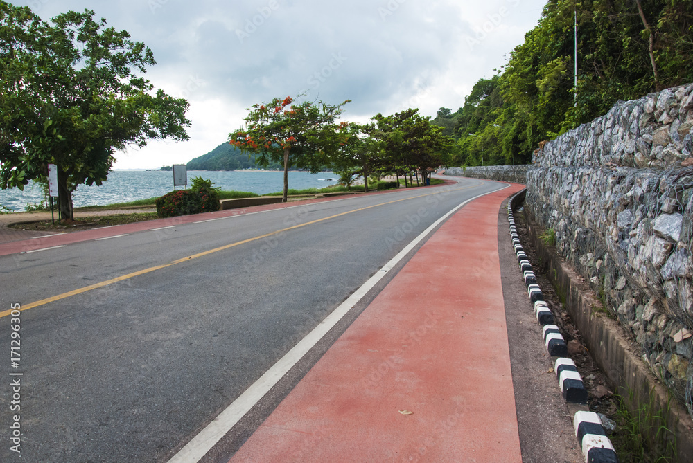 Road side view mountain and sea background,bicycle lane on the road. Stock  Photo | Adobe Stock