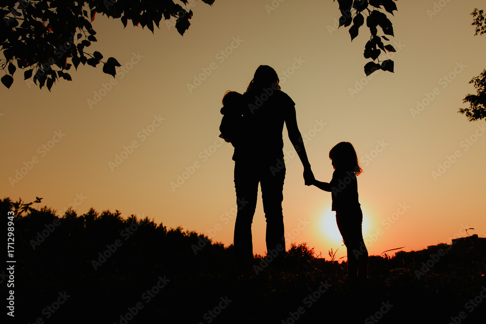 mother with two kids walk in sunset nature mother with two kids walk in sunset nature