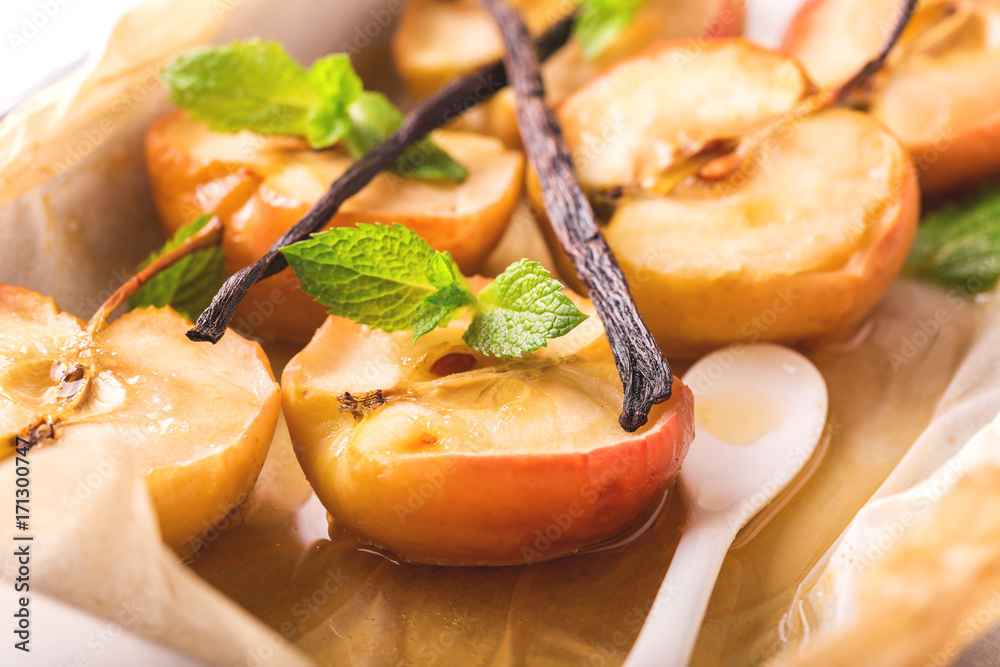 Baked red apples with vanilla syrop, mint and honey